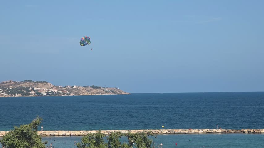 Parasailing Above the Mediterranean Sea Along Alicante Coast, Spain
