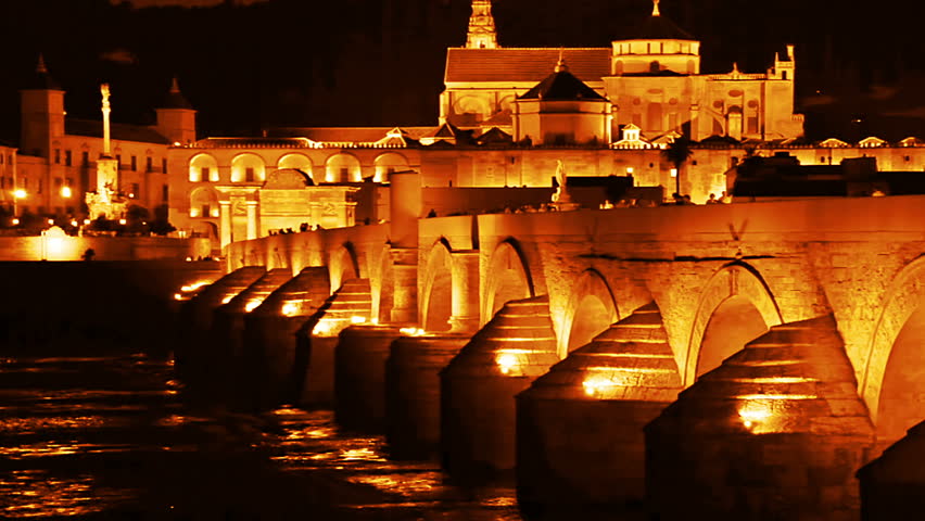 Spain. Cordoba. Roman bridge and Mezquita at night