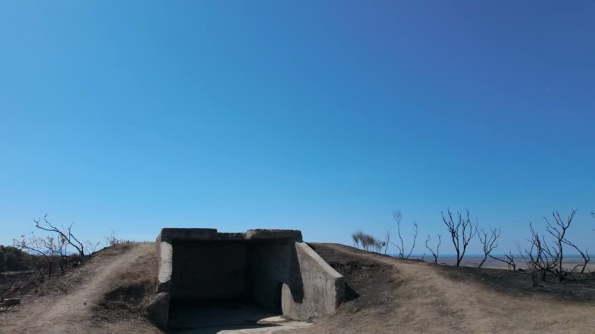 Shot of a second World War bunker with burned earth around it