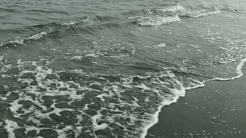 Sea waves on a sandy beach
