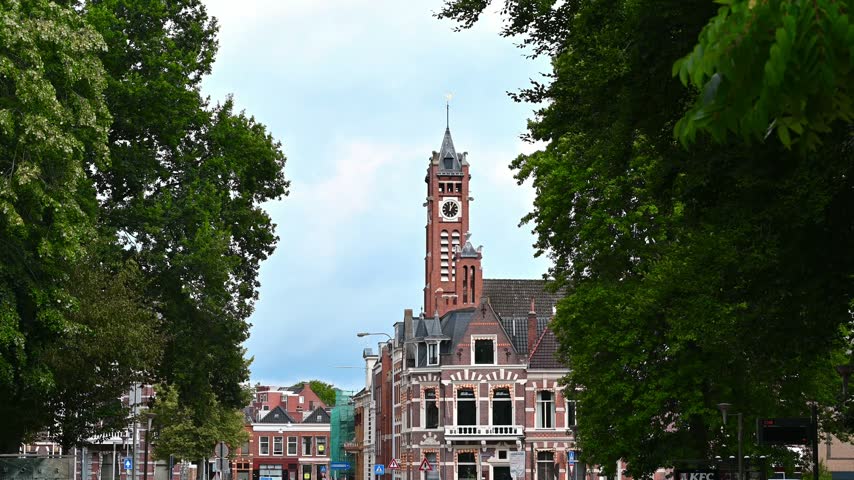 A daylight shot of the historic Academy Building (Academiegebouw) of the University of Groningen in the Netherlands, featuring its prominent clock tower.