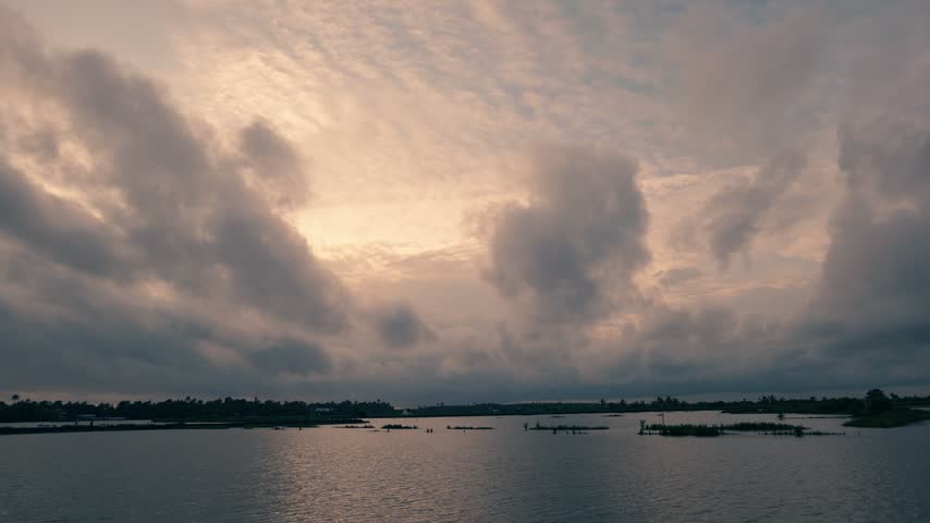Backwaters at dawn after sunset with blue and orange sky and lake