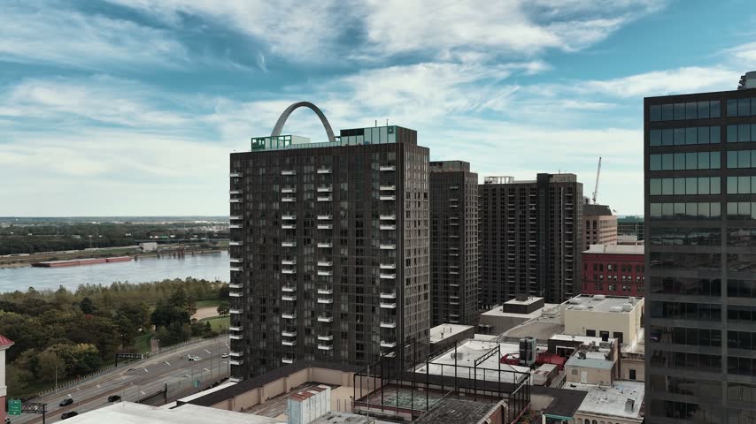 Aerial View of St. Louis Gateway Arch Above Downtown Buildings and Mississippi River