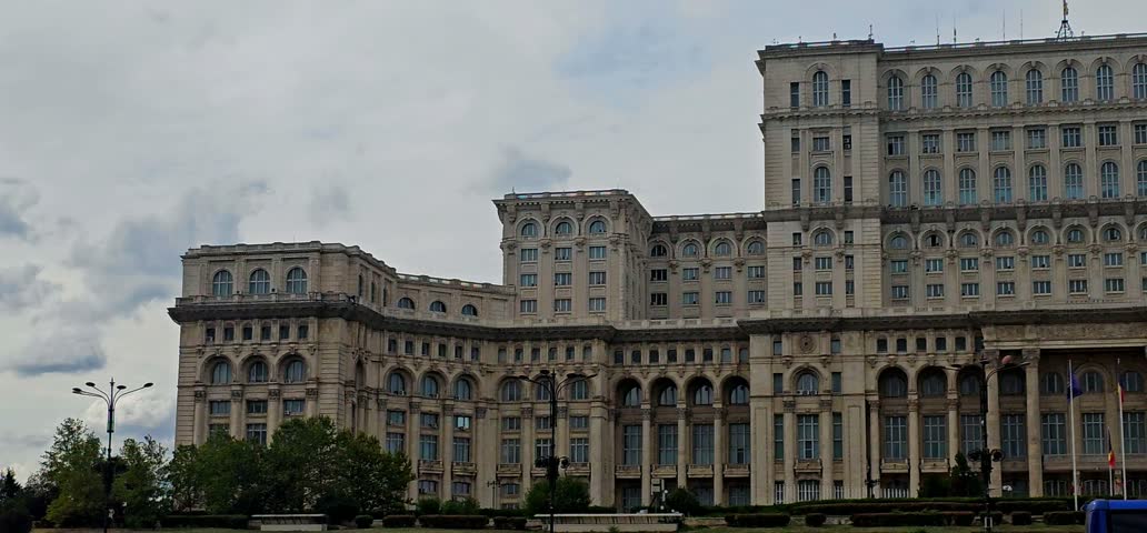 Wide view of the Palace of the Parliament in Bucharest, Romania, showcasing the monumental architecture of one of the country