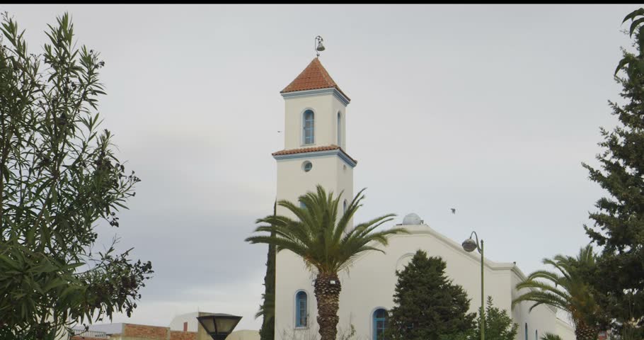 Chefchaouen White Church with Bell Tower and Palm Trees in Northern Morocco