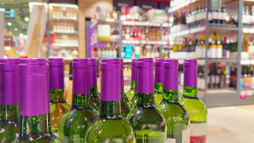 Assorted Alcohol Bottles on Display in Wine Section – Variety of Wine, Spirits and Liquor on Store Shelves
