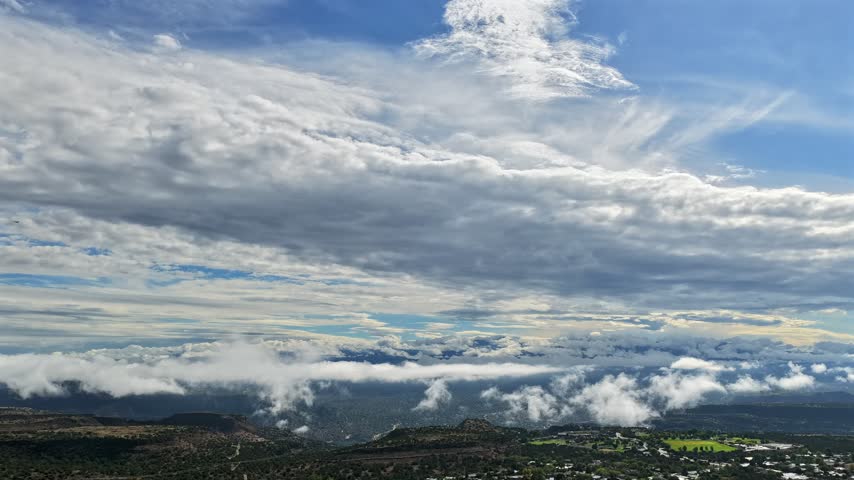 Aerial view of fog billowing over the canyon edge near the town of White Rock, New Mexico, United States.