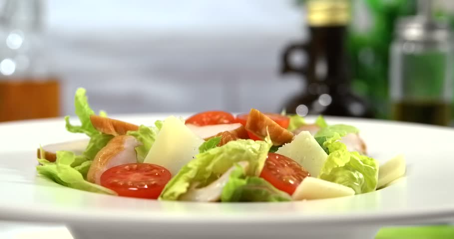 Caesar salad closeup on white kitchen background