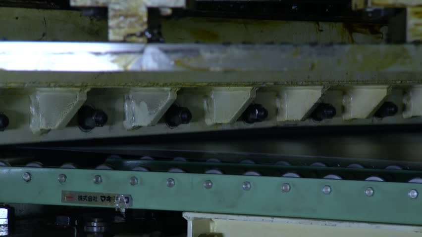 Machine is cutting sheet metal in automobile factory