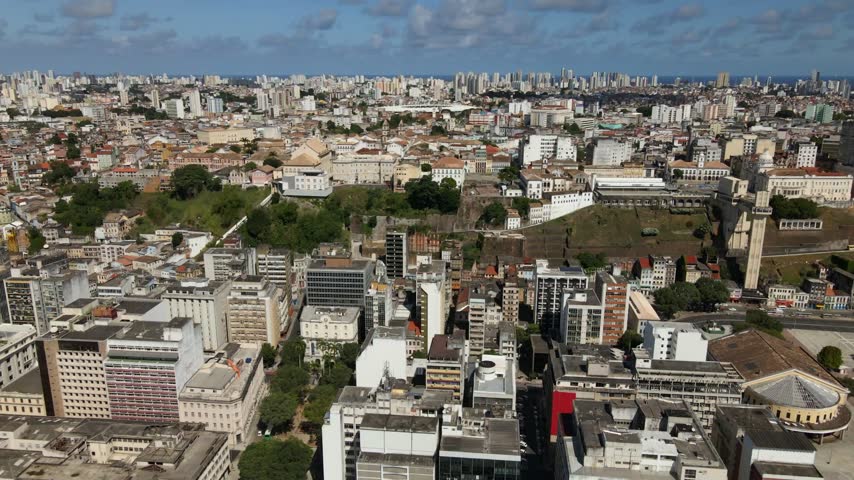 Aerial view of the dense urban landscape and historic architecture of Salvador, featuring the iconic Elevador Lacerda in Salvador, Bahia, Brazil.
