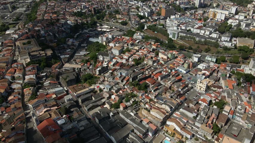 Aerial view of the historic urban landscape of Salvador, featuring dense residential rooftops, narrow streets, and colonial architecture in Salvador, Bahia, Brazil.