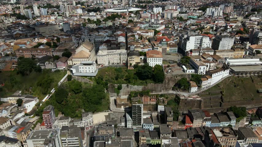 Aerial view of the historic city center of Salvador, featuring colonial architecture, dense urban rooftops, and elevated terrain overlooking the lower city in Salvador, Bahia, Brazil.