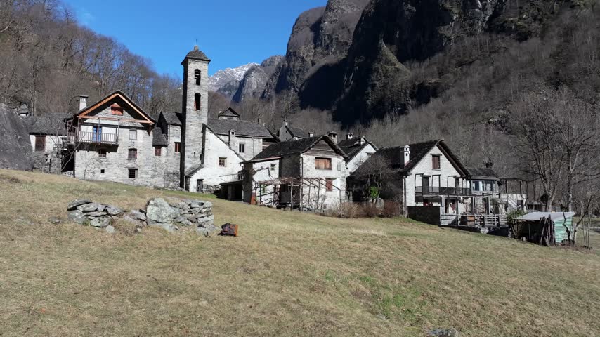 Aerial view of the historic stone houses and church tower in the mountain village of Foroglio in Cevio, Ticino, Switzerland.