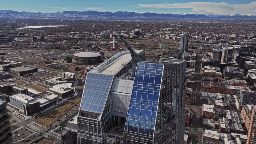 Aerial view of the modern glass skyscrapers and urban landscape of downtown Denver, Colorado, United States.