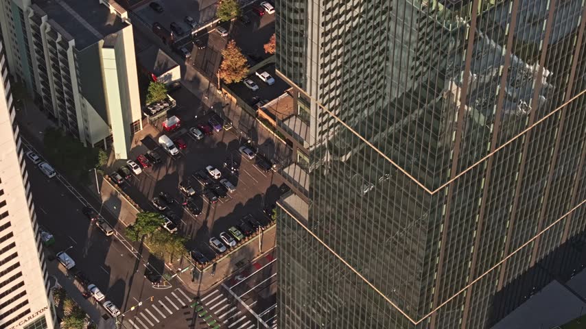 Aerial view of modern glass skyscrapers and street parking in downtown Denver, Colorado, United States.