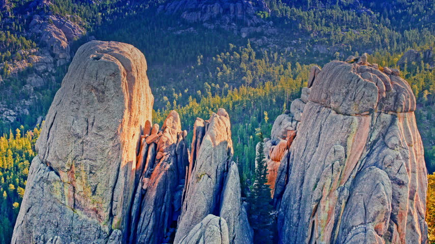 Cinematic aerial footage of rugged rock formations in the wilderness of South Dakota’s Black Hills.