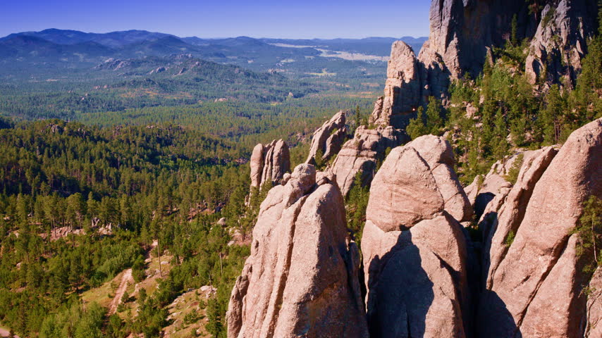 Cinematic aerial view of remarkable geological formations in the scenic wilderness of South Dakota’s Black Hills.