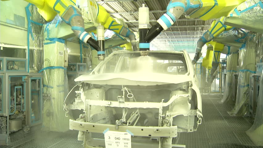 Robots are painting automobile in factory