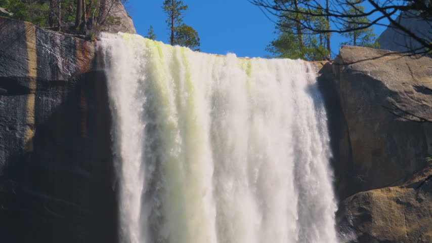 Cinematic slow motion shot of Vernal Falls on Mist Trail in Yosemite National Park in California, USA