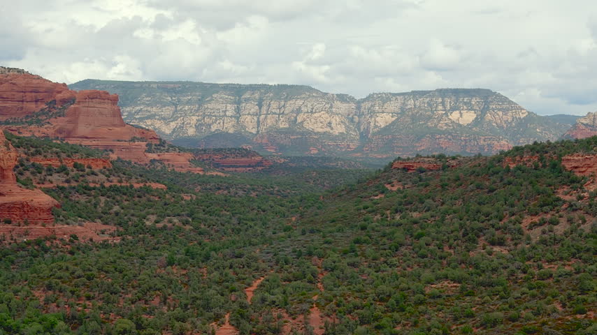 Red Rock Formations And Green Canyon Vegetation In Sedona Area Of Arizona, United States. Aerial Shot