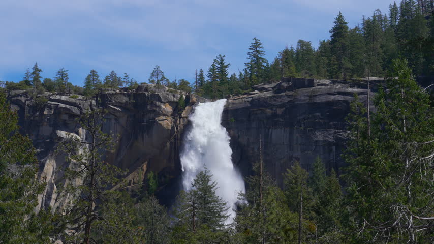 Cinematic slow motion shot of Vernal Falls on Mist Trail in Yosemite National Park in California, USA