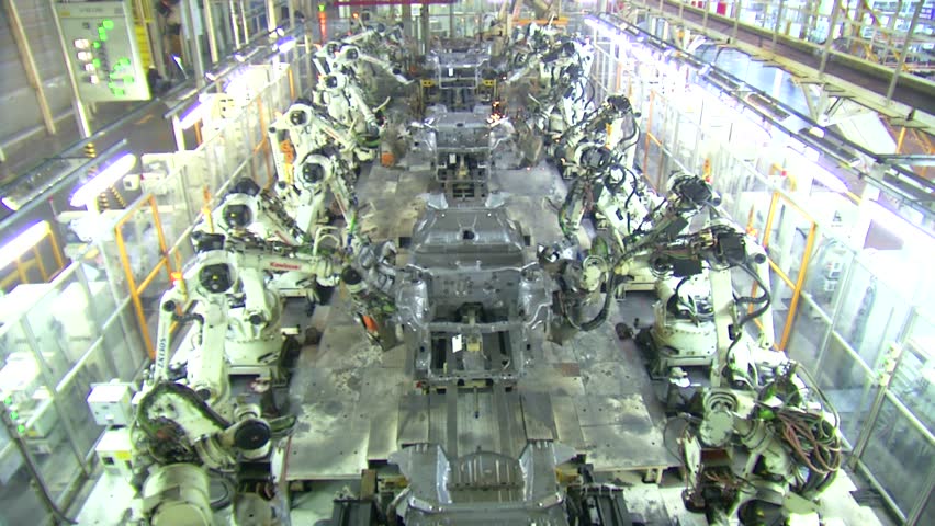 Robots are welding in automobile factory