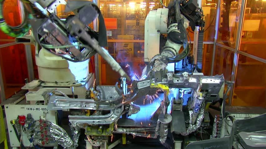 Robots are welding in automobile factory. jib shot.  Royalty-Free Stock Footage #4203265