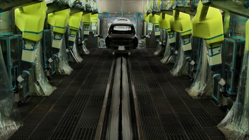 Robots are painting in automobile factory