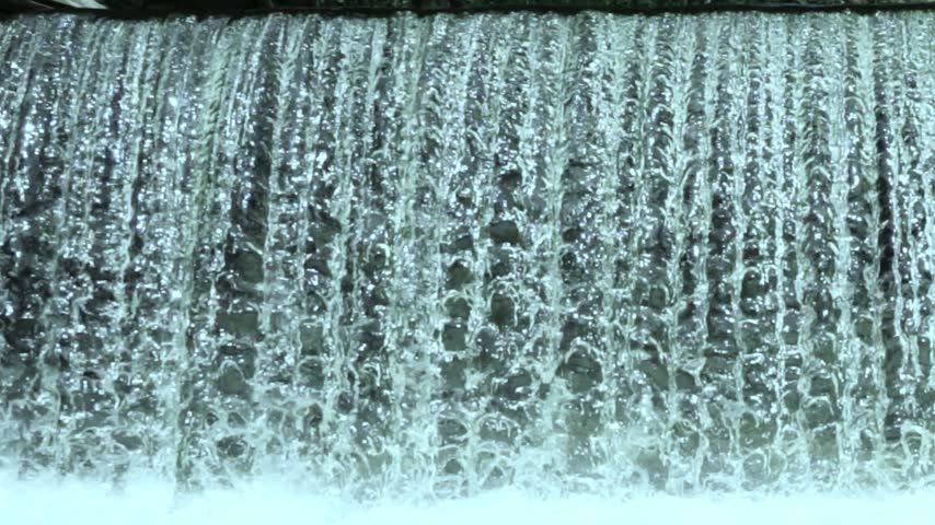 Scenic Waterfall Rushing Down Rocks with Powerful Currents and Fresh Water