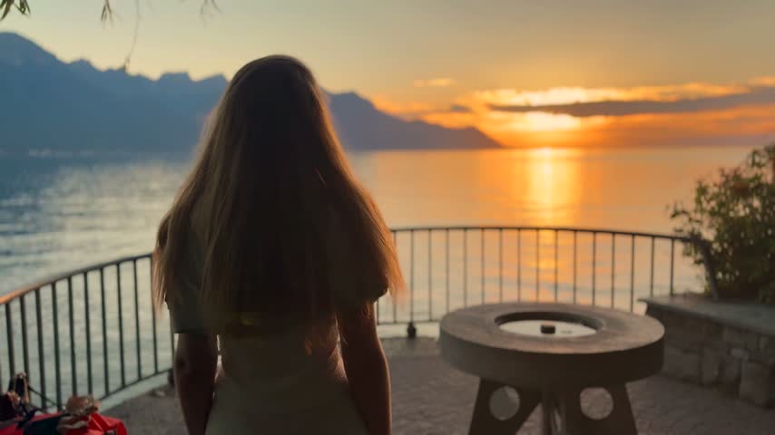 Young Blonde Woman Enjoying Sunset by Lake Geneva in Switzerland