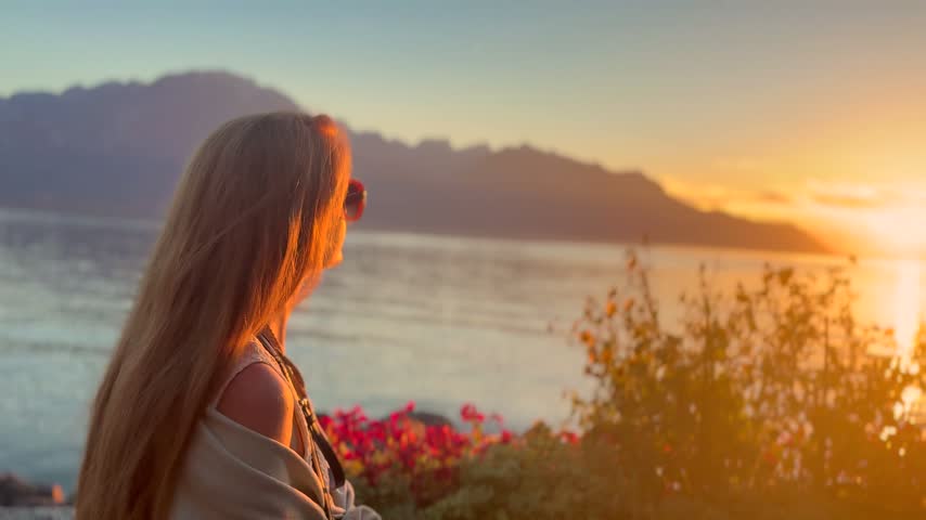 Young Blonde Woman Enjoying Sunset by Lake Geneva in Switzerland