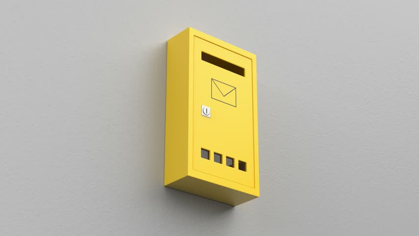 Yellow mailbox on grey wall