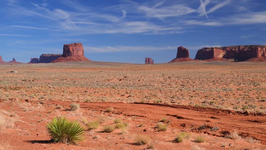 Monument Valley, located on the border of Arizona and Utah in the United States, within the territory of the Navajo Nation. A sandy semidesert landscape on the Colorado Plateau, characterized by distinctive sandstone buttes, monoliths, and mesas.