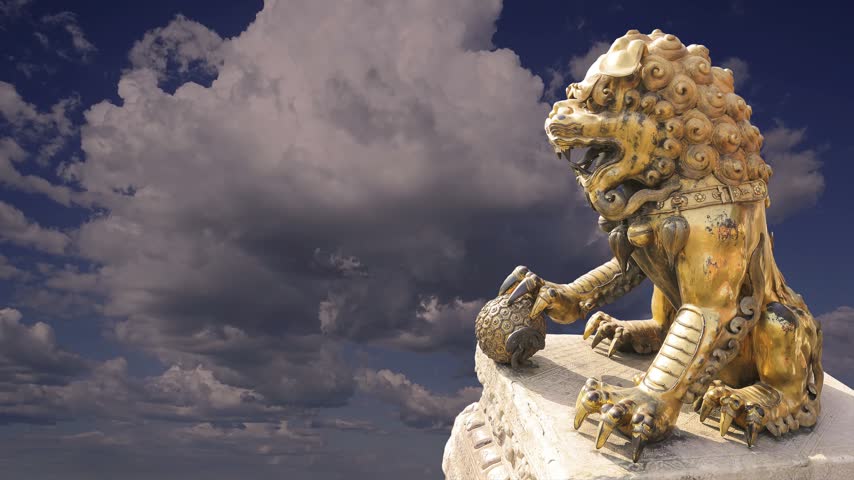 A bronze Chinese dragon statue (against the sky with clouds) in the Forbidden City. Beijing, China. 4K, time lapse