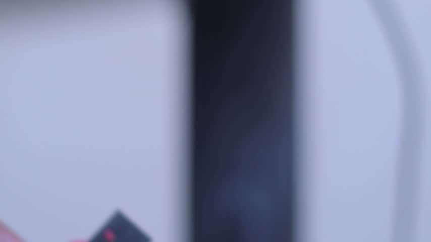 Close-up footage showcasing a USB flash drive, a portable device used for storing and transferring digital files. The video highlights the design and details of the USB storage device, making it suitable for technology advertisements, computer tutorials, data storage concepts, digital security content, office work projects, and product demonstrations.