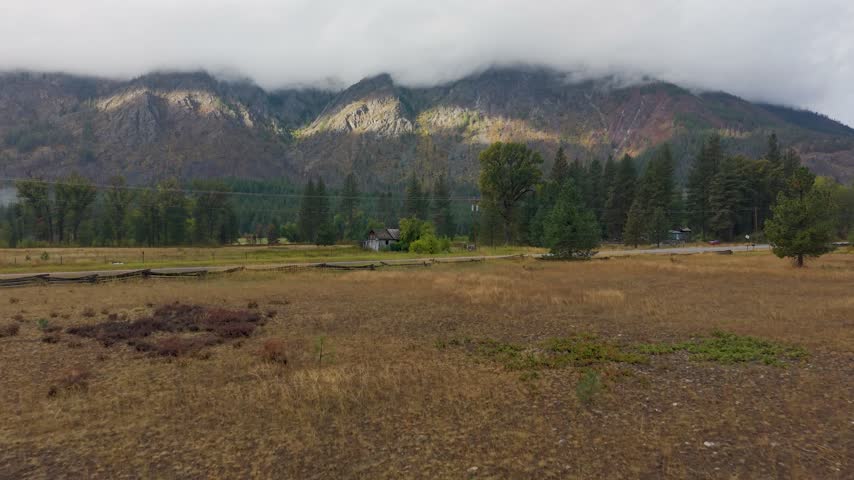 Old Farm House and Rural Lands in Winthrop Washington - Angled Ascending Shot