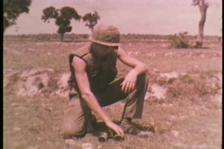 1960s - Soldiers interrogate an informant about local Vietcong movements and tunnels during the Vietnam War