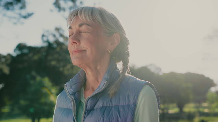 Thinking, smile and old woman in nature with fresh air, daydream and unwind with calm mindset. Retirement, flare and elderly person with breathing, outdoor break and peaceful perspective in park.