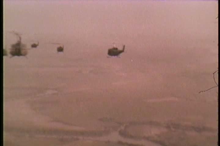 1960s - Helicopters shoot at Vietcong and transport troops during the Vietnam War