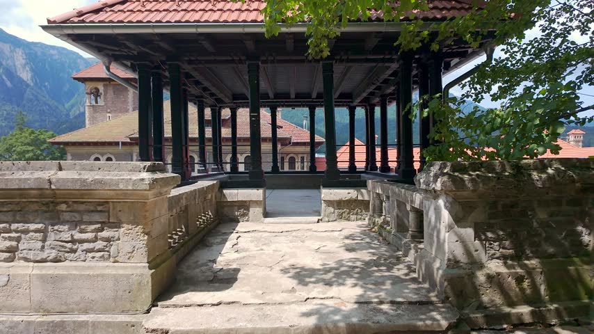 Covered wooden terrace with columns overlooking the mountains at Cantacuzino Castle in Busteni Romania
