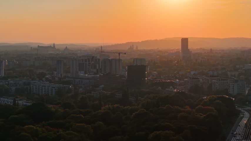 Sunset aerial view over Krakow cityscape and urban buildings, Poland