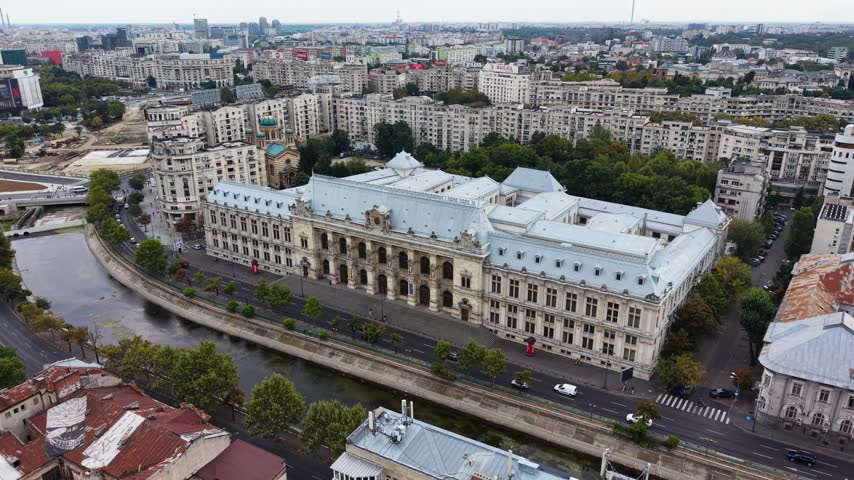 Aerial view of Palace of Justice along Dambovita River in Bucharest, Romania