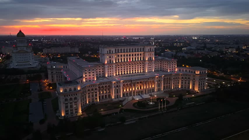 Dusk aerial shot of Palace of the Parliament in Bucharest city, Romania