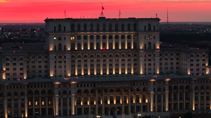 Dusk aerial view of massive Palace of the Parliament in Bucharest, Romania