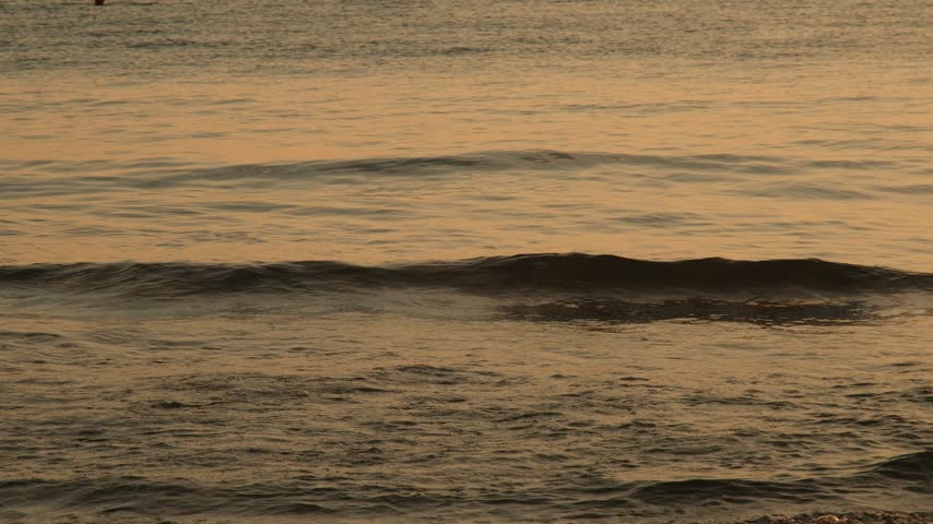 Tranquil sunset over the sea from a sandy beach