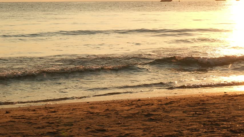 Tranquil sunset over the sea from a sandy beach