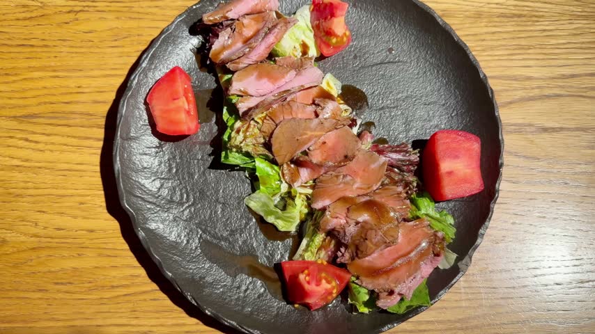 Beef Salad on Plate on Restaurant Table – Fresh Vegetable and Meat Salad Served for Lunch or Dinner