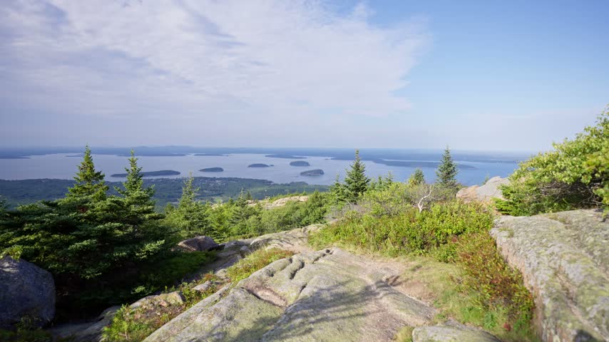 Acadia National Park, Maine landscape video from Cadillac Mountain overlooking Frenchman Bay, offshore islands, and evergreen forests on Mount Desert Island.