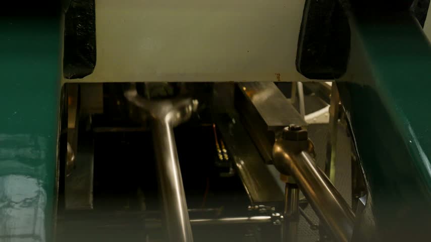 Detail of the moving parts of a large, powerful industrial machine working and rotating. Switzerland