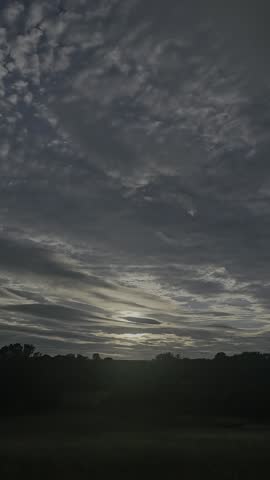An evening glow spreads across the landscape at Coundon Wedge in Coventry, within the West Midlands of England.